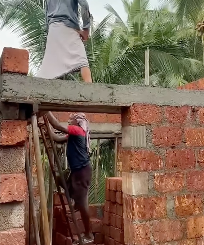 Laterite wall construction around a doorway in Salvador do Mundo
